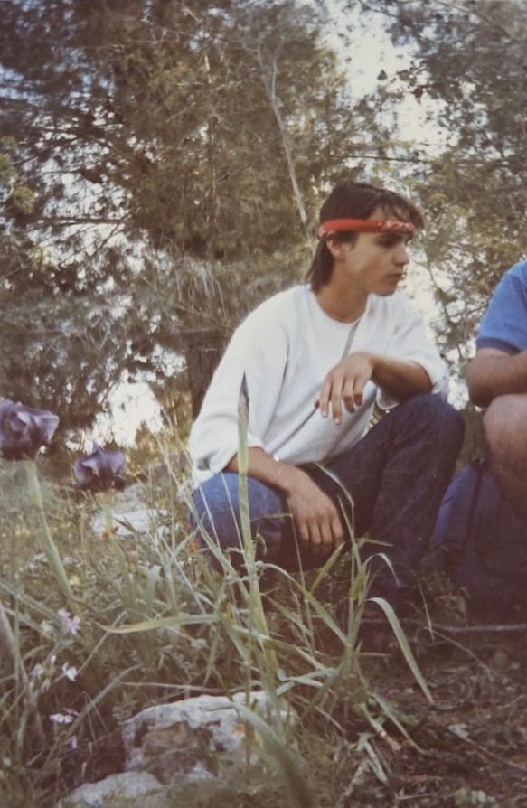 Avi_Bandana_watchin_flowers_in_the_forest